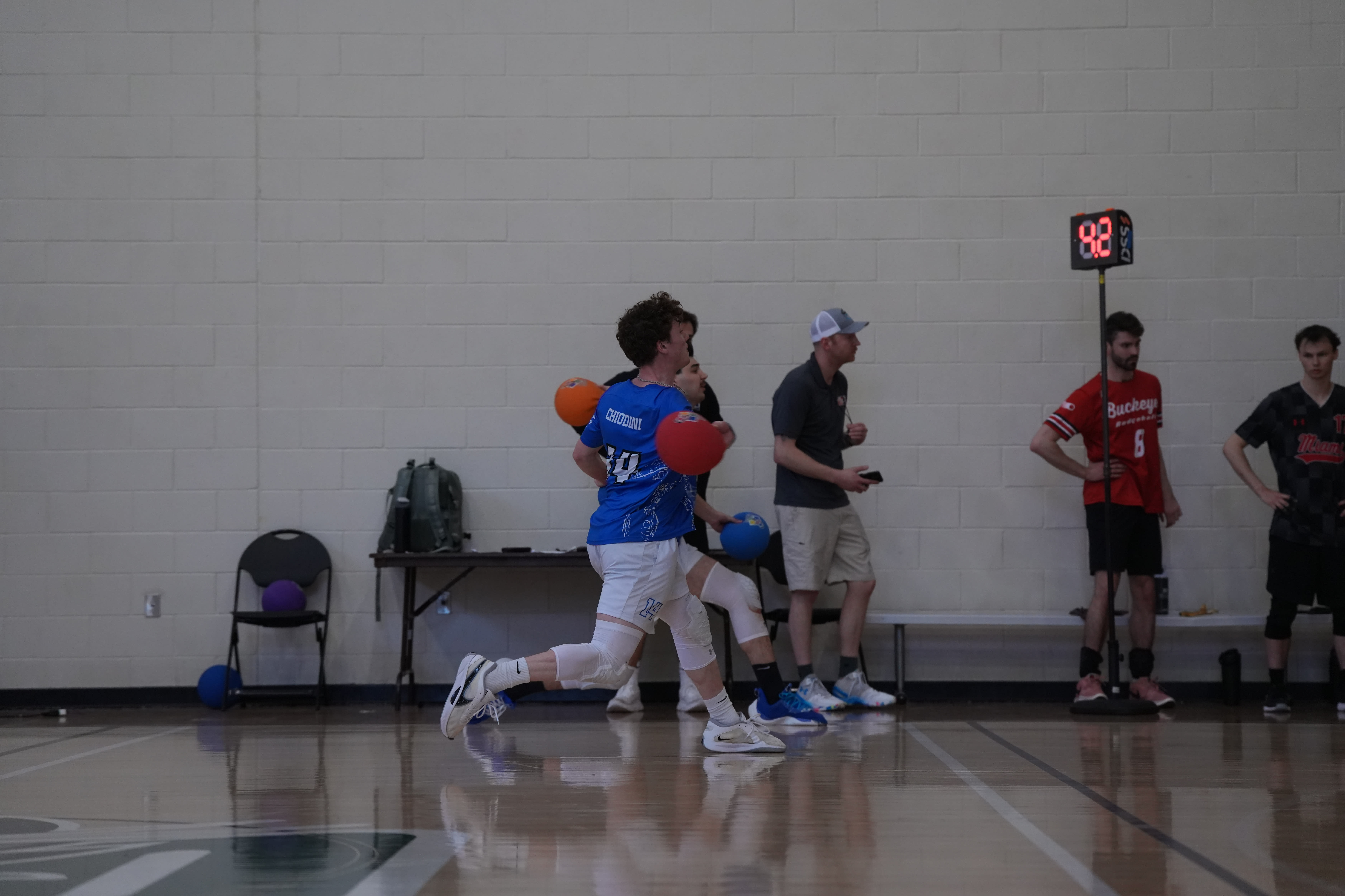 Dodgeball players using the official DSS timing technology on the court